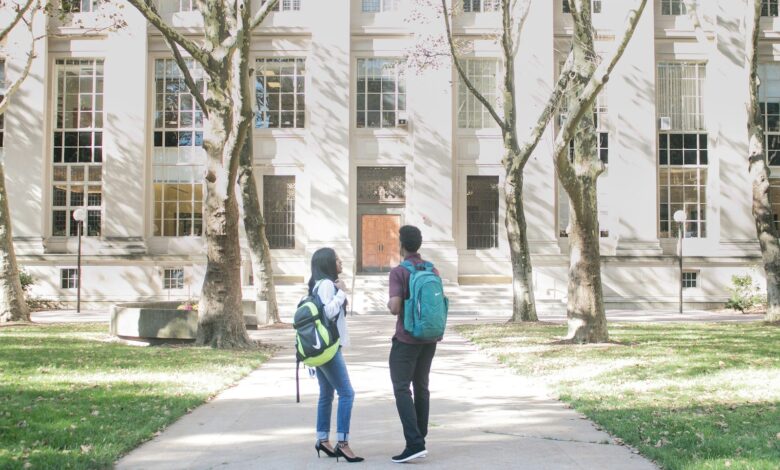 a couple of people that are standing in front of a building