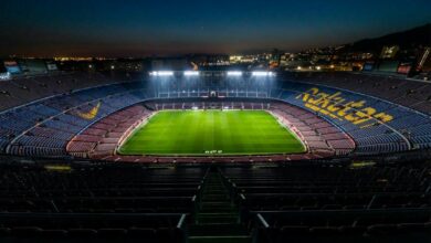 stadium with lights turned on during night time